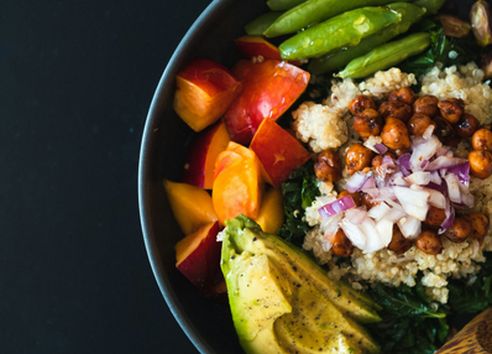 Close up of salad bowl containing high fibre ingredients, including chickpeas and avocado