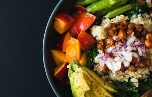 Close up of salad bowl containing high fibre foods, including chickpeas and avocado
