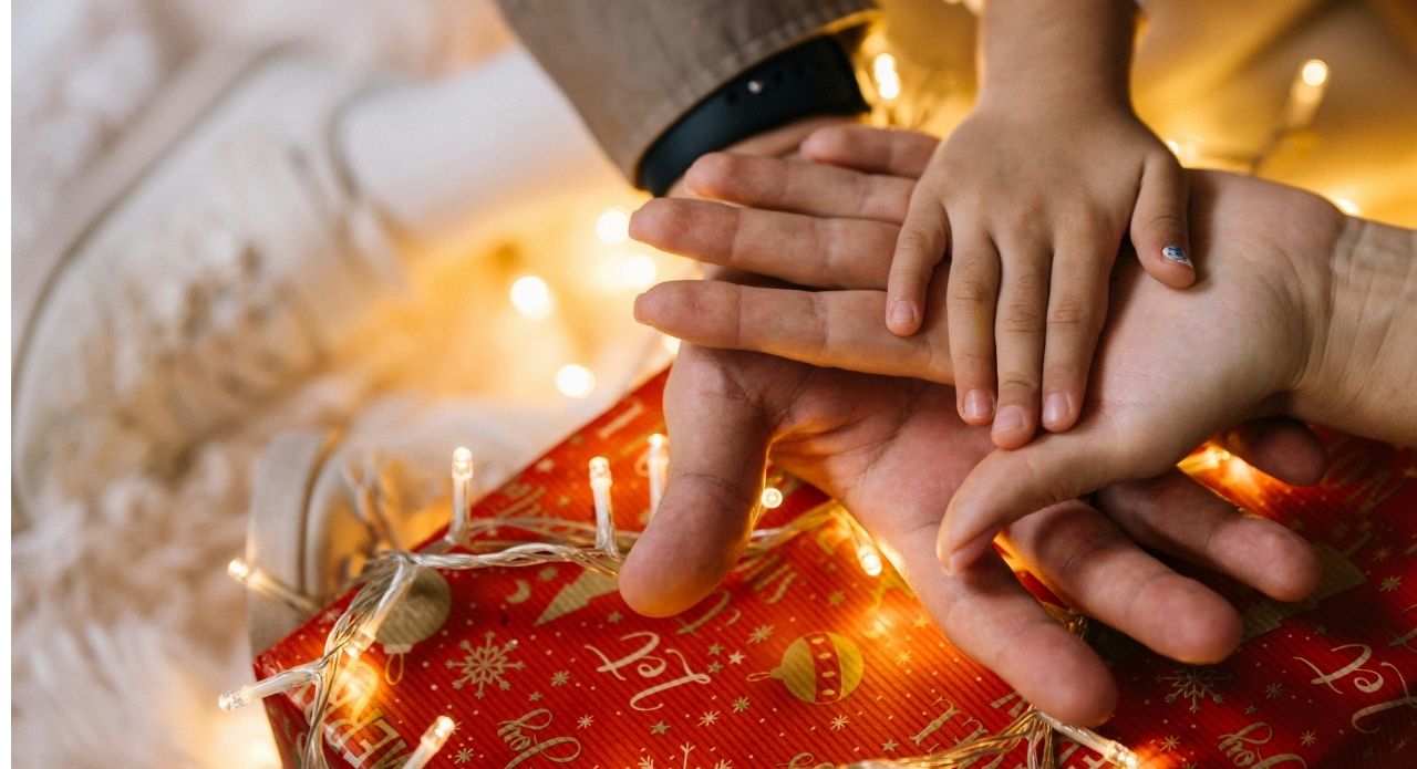 Family placing hands on one anothers