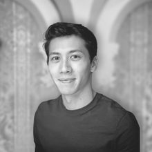 Man smiling at camera in black and white with brown hairDr Alexander Mørch