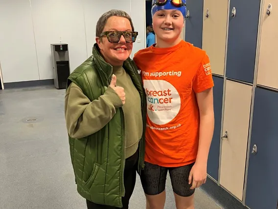mother and son in changing room hallway in swimming gear