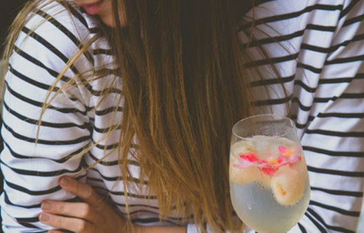 Close up of woman holding non-alcoholic drink