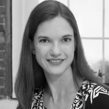 Woman in black and white headshot smiling at camera with long brown hairDr Jennifer Kay