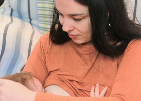 Close up of woman breastfeeding baby