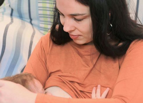 Close up of woman breastfeeding baby